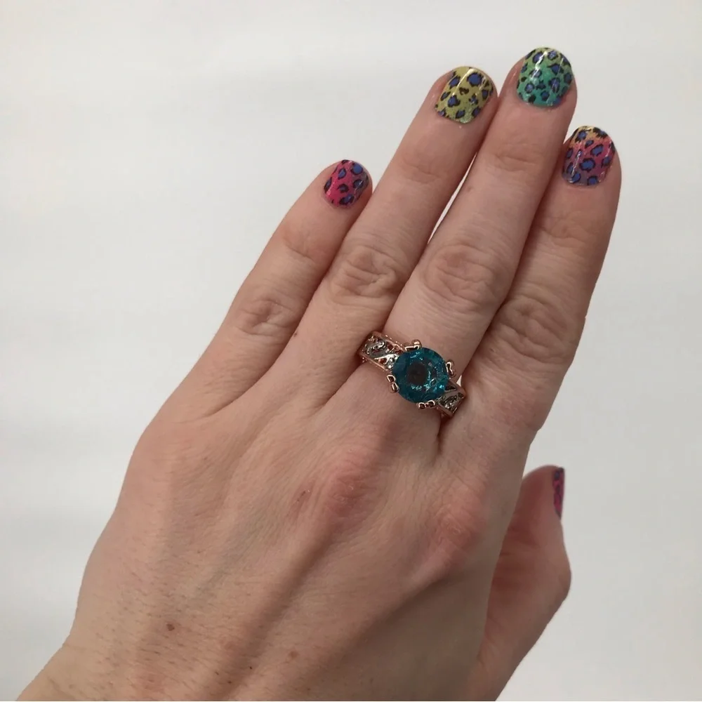 Mixed Metal Solitaire Ring with Blue Stone